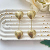 Golden heart drop earrings