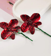 Red floral enamelled earrings