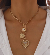 White stoned heart and evil eye necklace